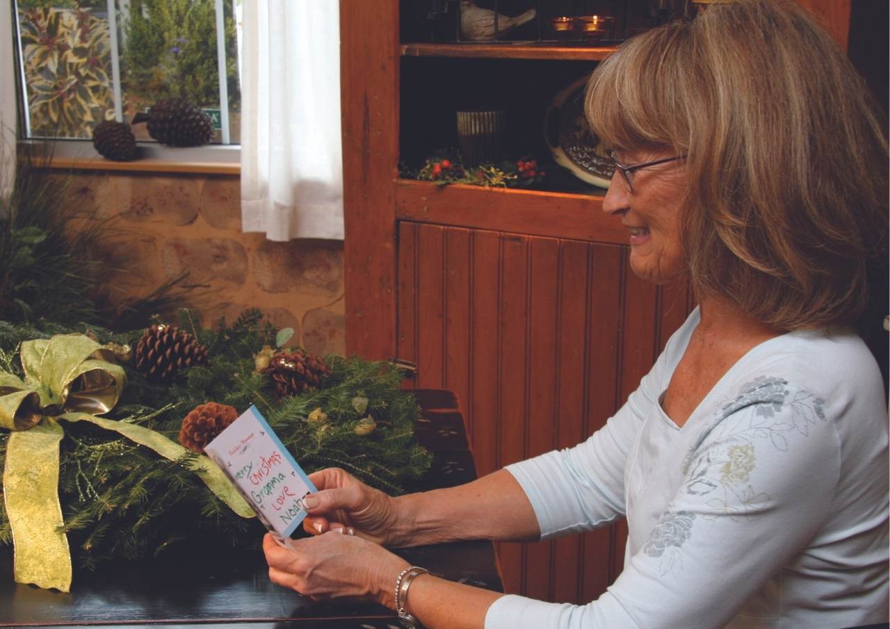 Grandma opening wreath and card